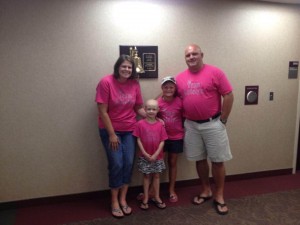 Katelyn with mom Stacy, big sister Kyla and Brian on the last day of radiation.